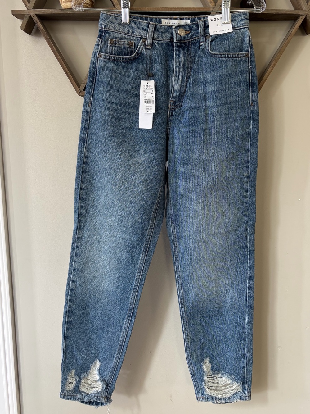 NWT Topshop mid-blue distressed high-rise mom jeans. Size 26x30.